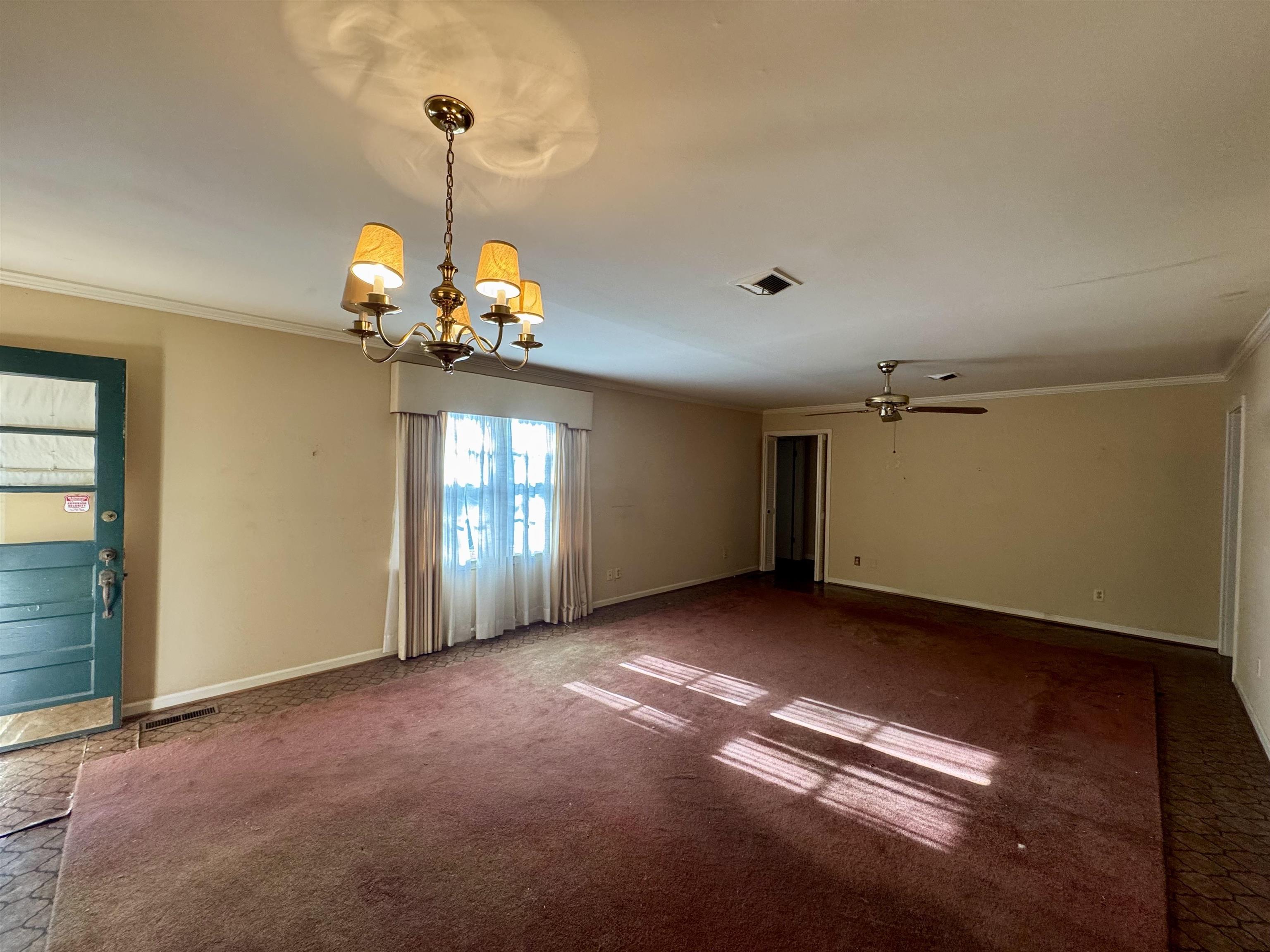 1015 Crestview Street Covington, TN 38019 - Photo 9 of 33 a view of a chandelier and window in a room