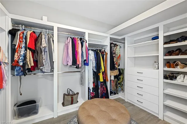 a bedroom with a bed and a night stand