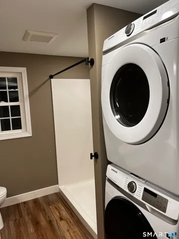 a view of a hallway with washer and dryer