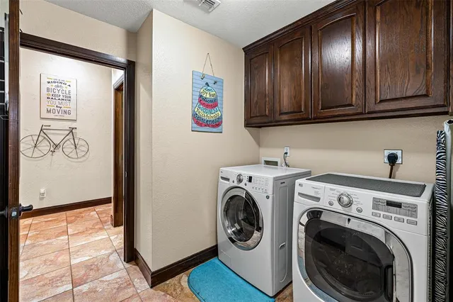 a view of a hallway with washer and dryer