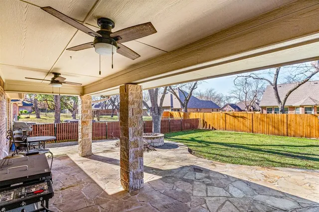 a room with lots of trees and a glass door