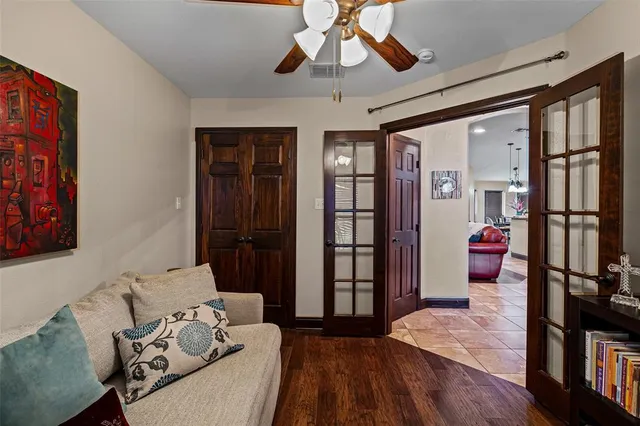 a bedroom with furniture and a ceiling fan