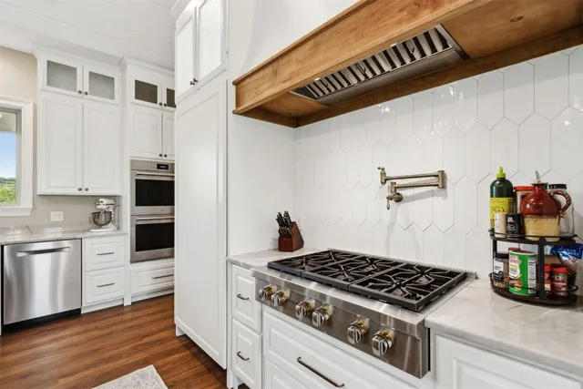 a view of a house with a swimming pool and a yard