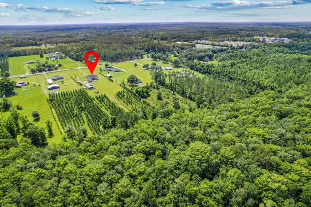 a living room with furniture fireplace and flat screen tv