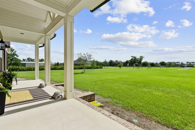 a kitchen with a sink cabinets and wooden floor