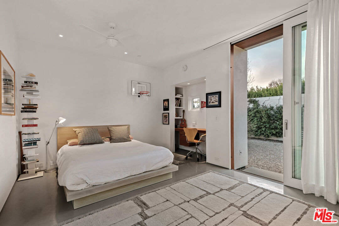6728 Wildlife Road Malibu, CA 90265 - Photo 25 of 57 a bedroom with a bed and a window