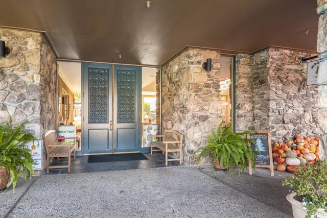 a view of front door with outdoor seating