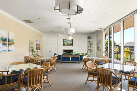 a view of a dining room with furniture window and outside view
