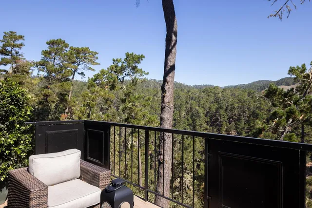 a view of a balcony with chairs