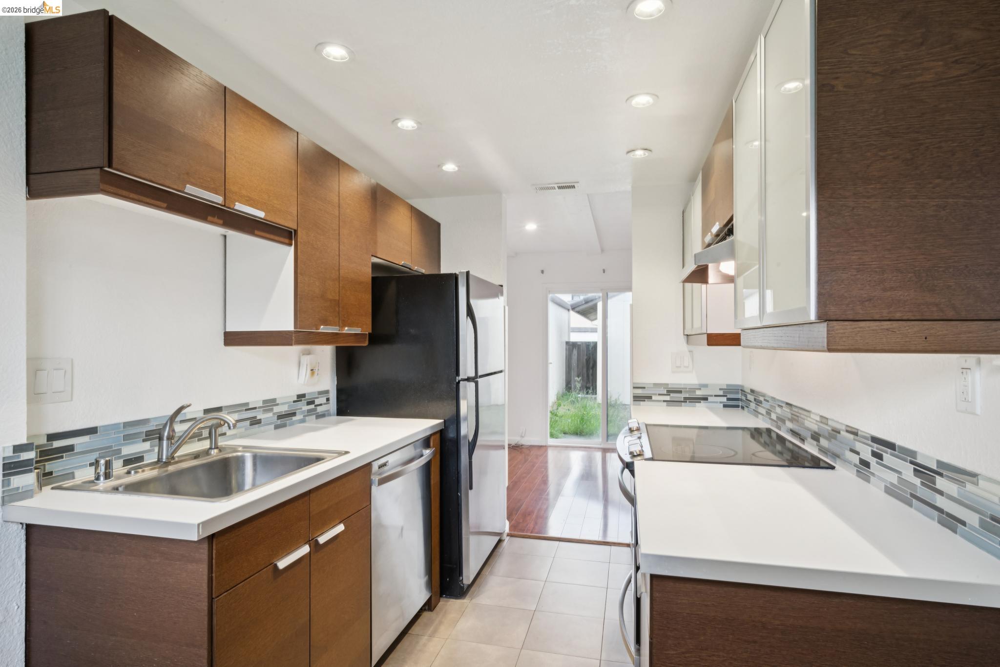 2600 Giant Road, Unit 35 San Pablo, CA 94806 - Photo 8 of 15 a kitchen with a sink a stove a refrigerator and a sink