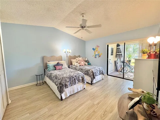 a spacious bedroom with a bed and window