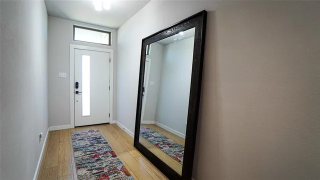 a view of hallway with mirror