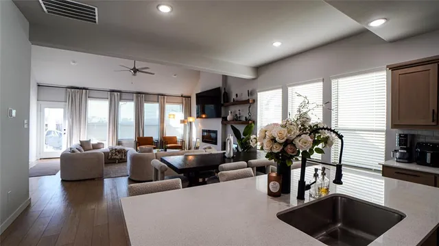 a living room with furniture gym equipment and a large window