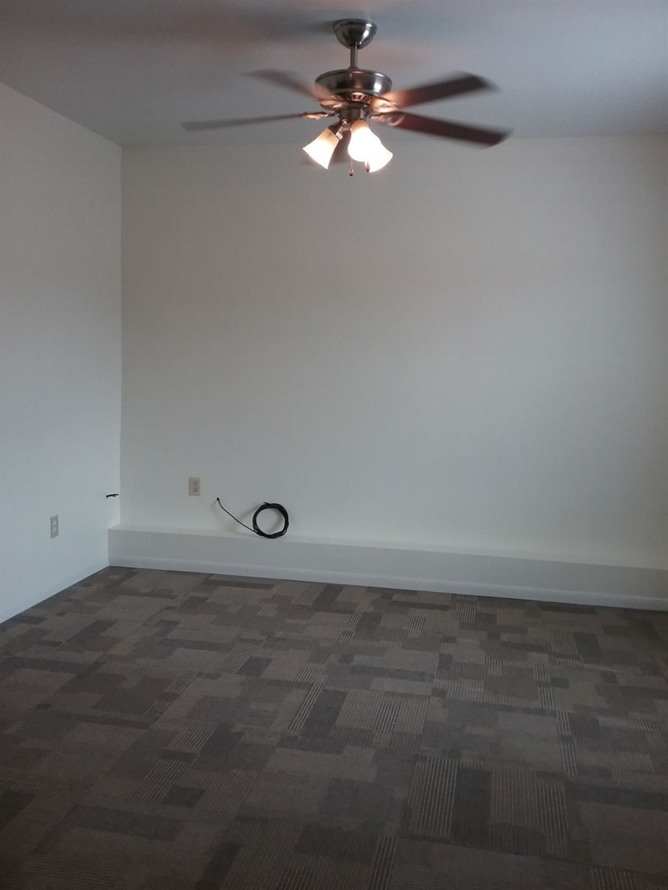 708 Pines Road Oregon, IL 61061 - Photo 17 of 22 en empty room with ceiling fan and window