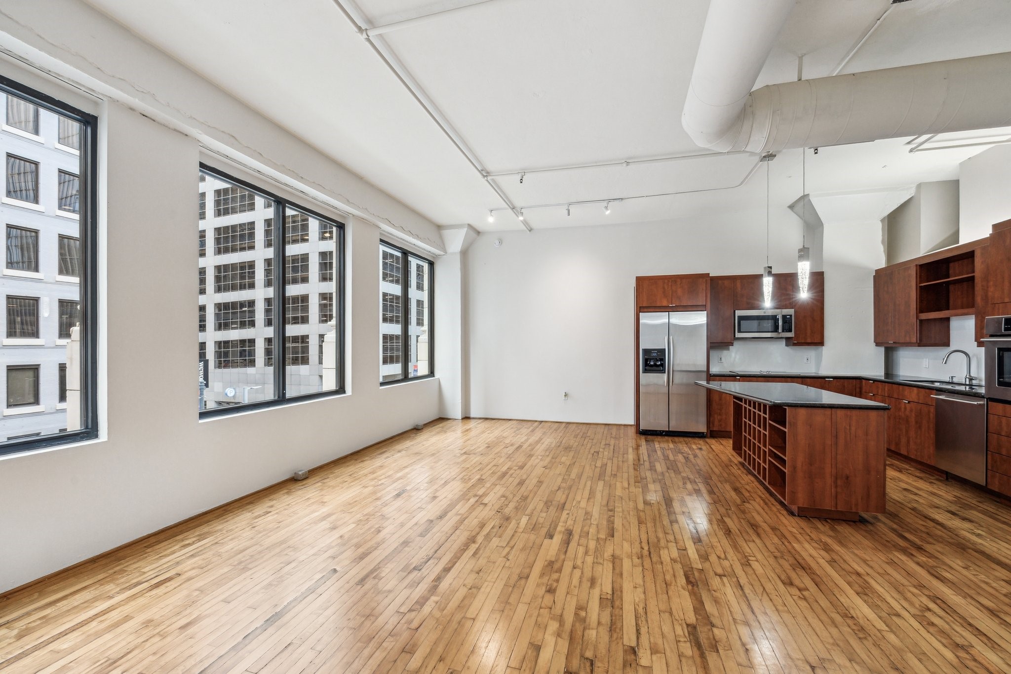 705 Main Street, Unit 302 Houston, TX 77002 - Photo 4 of 23 Note the huge, double windows that allows natural light to flood the unit.