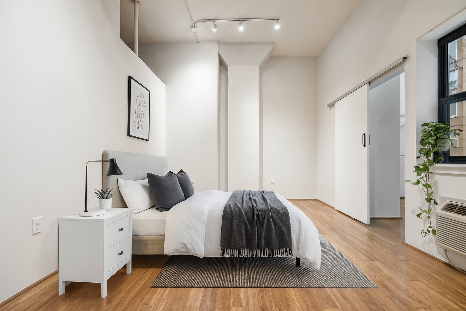 705 Main Street, Unit 302 Houston, TX 77002 - Photo 10 of 23 Huge primary bedroom. Doors access expansive closet.