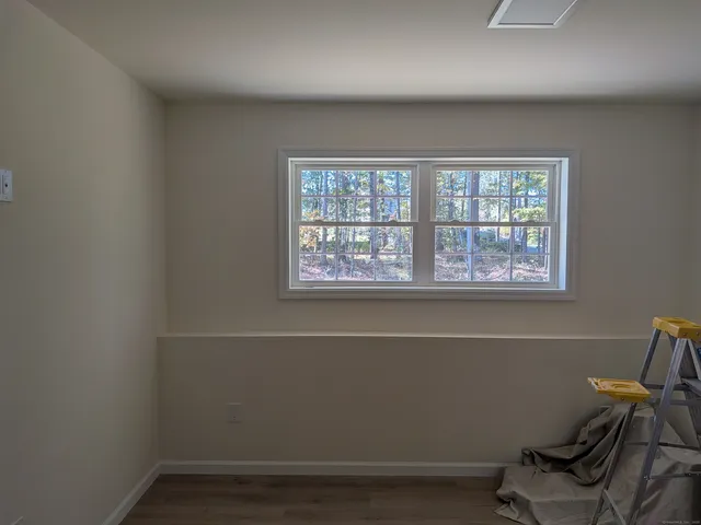 a view of a room with gym equipment and windows