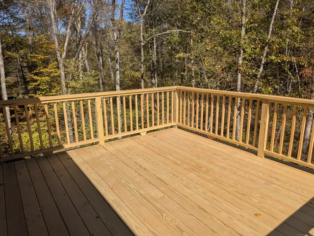 a view of balcony with wooden floor