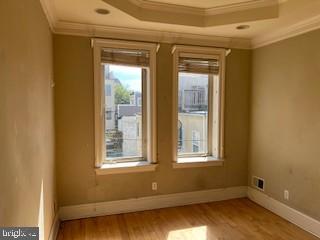 3409 Dillon Street Baltimore, MD 21224 - Photo 11 of 18 a view of an empty room with a window