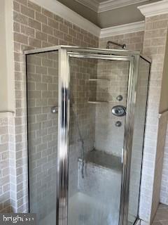 3409 Dillon Street Baltimore, MD 21224 - Photo 14 of 18 a bathroom with a glass shower door