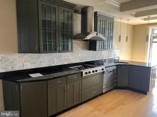 a kitchen with granite countertop a stove and a sink