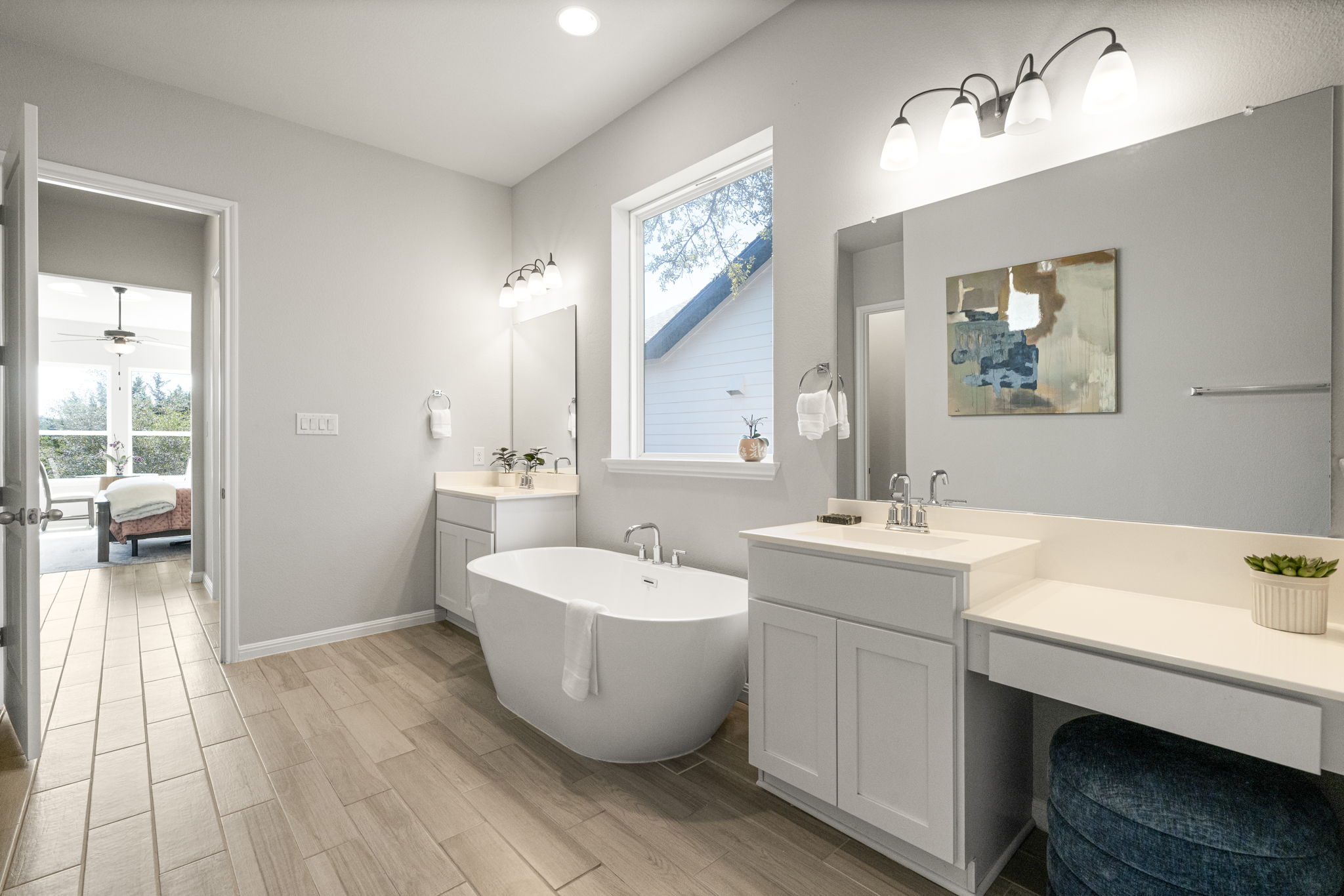 546 Hazy Hills Loop Dripping Springs, TX 78620 - Photo 23 of 40 The spacious primary bath blends comfort and functionality with elegant finishes and a calming design.