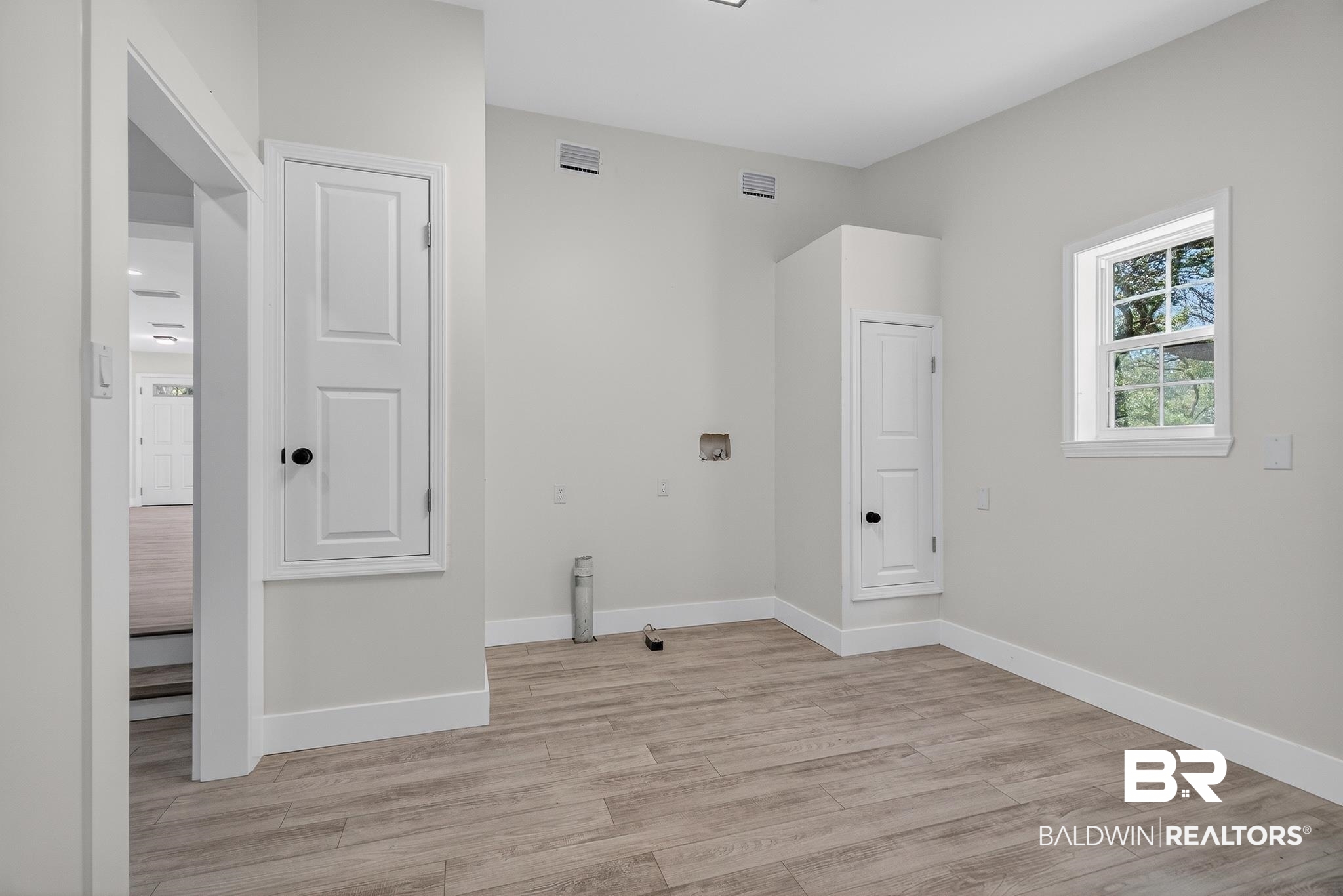10650 Old Pascagoula Road Theodore, AL 36582 - Photo 54 of 77 Laundry room with light wood finished floors and washer hookup