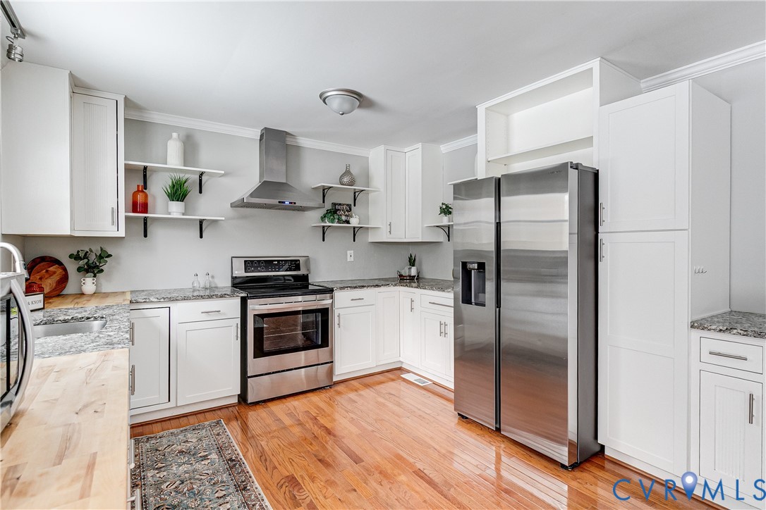 10907 Baxter Road Glen Allen, VA 23060 - Photo 12 of 42 a kitchen with stainless steel appliances granite countertop a refrigerator and a stove top oven