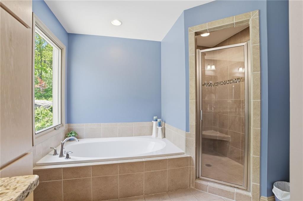3326 Monument Road Jasper, GA 30143 - Photo 20 of 49 a white bath tub sitting next to a tub