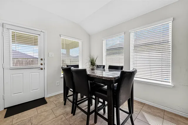 a bedroom with a bed and a chair