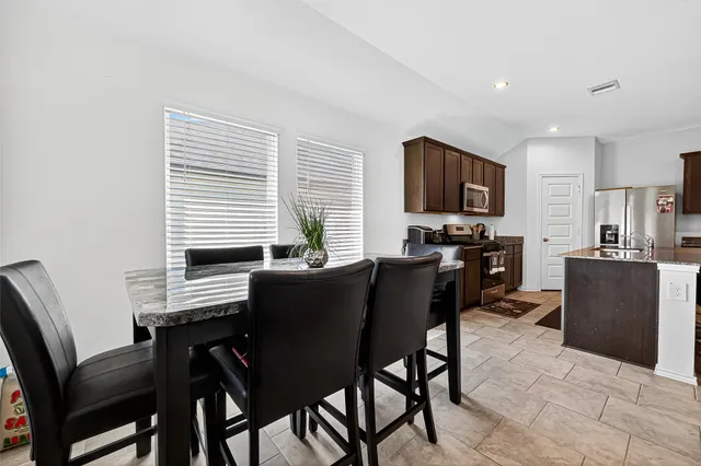 a bedroom with a bed and a tv