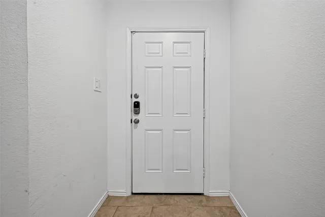 a work room with furniture and a potted plant