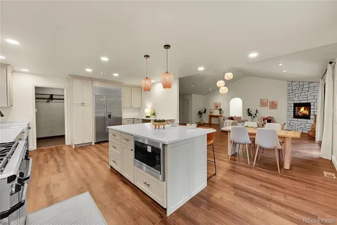 a view of kitchen with cabinets and wooden floor