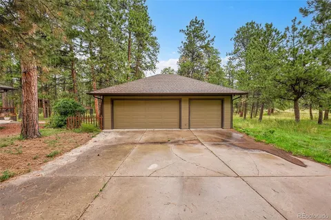 a view of a wooden deck with a backyard