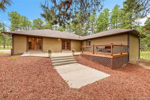 a backyard of a house with lots of green space