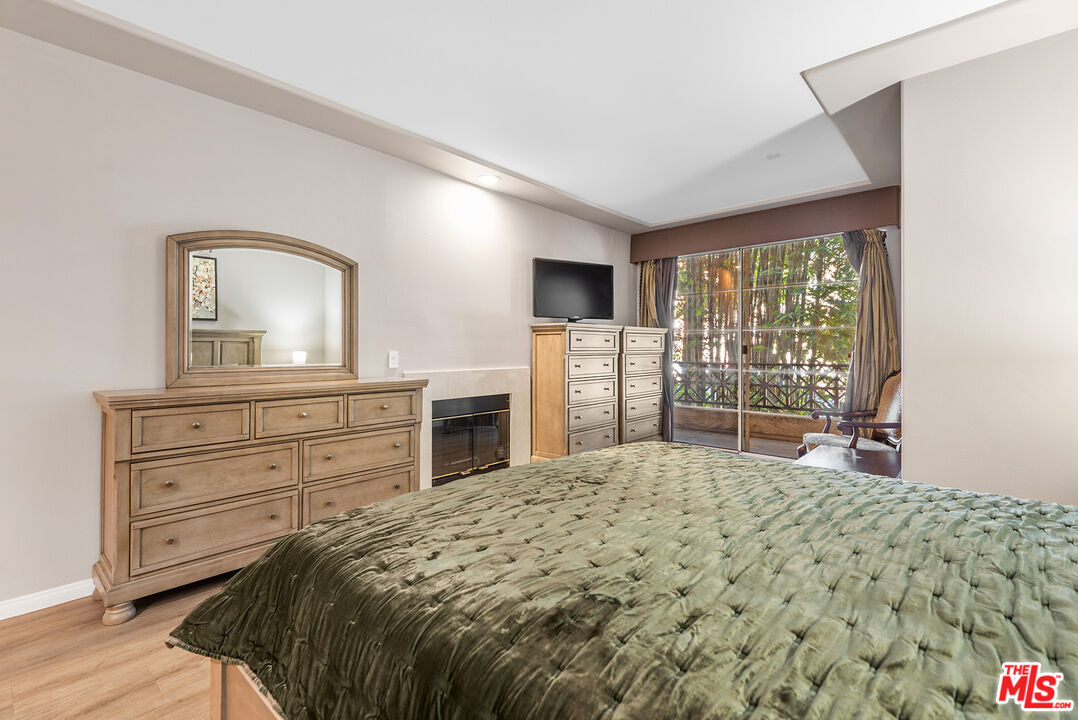 1875 South Beverly Glen Boulevard, Unit 106 Los Angeles, CA 90025 - Photo 15 of 30 a bed room with a bed and a television