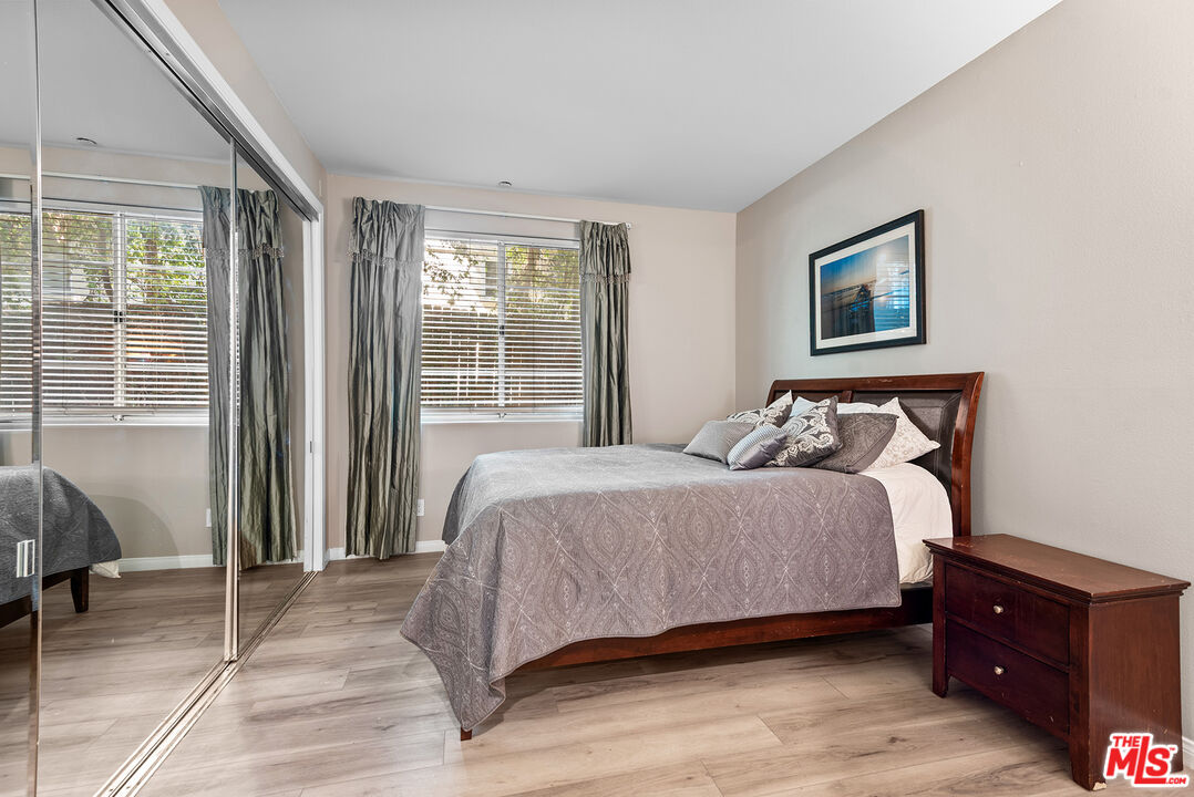 1875 South Beverly Glen Boulevard, Unit 106 Los Angeles, CA 90025 - Photo 21 of 30 a bedroom with a bed and a window