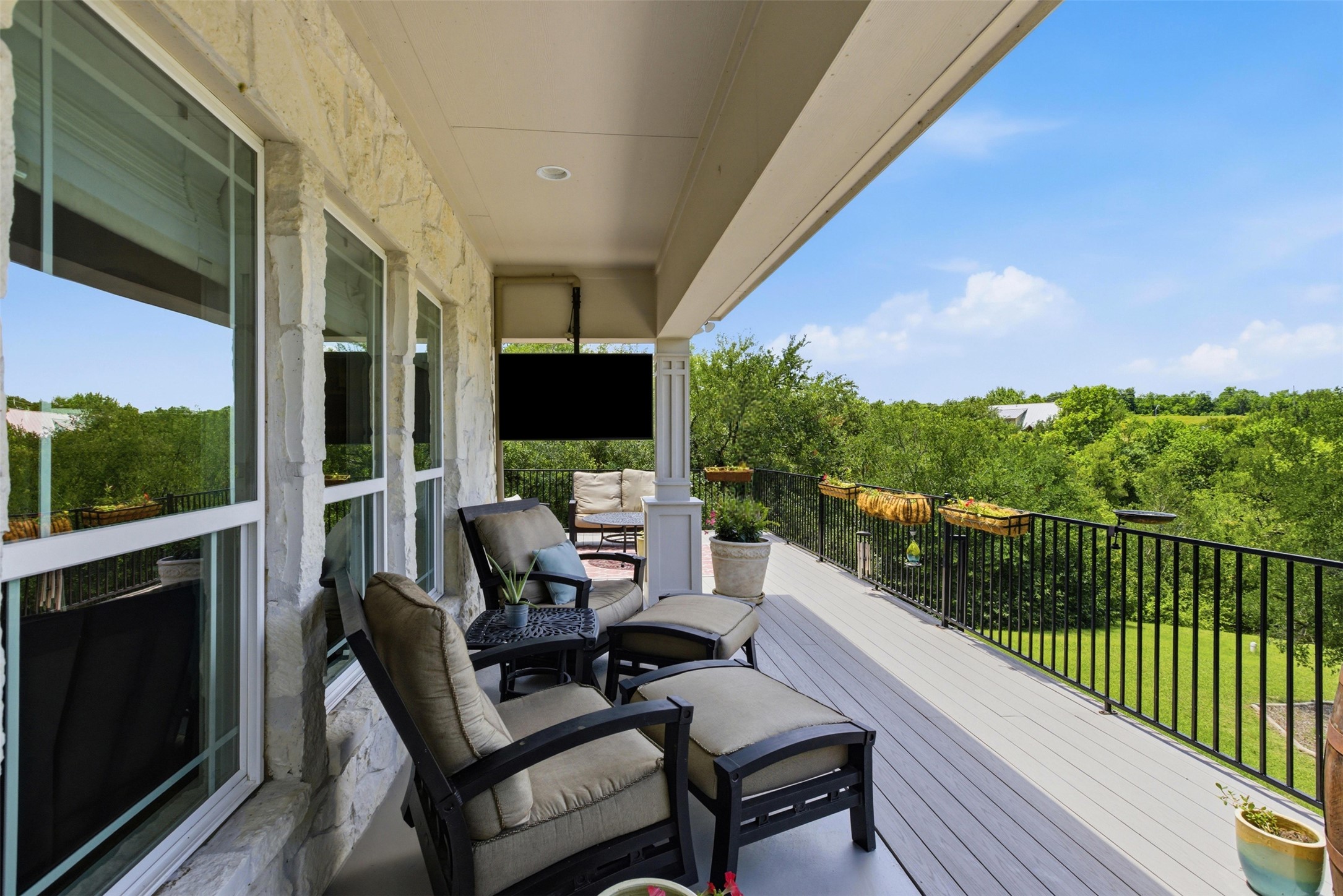 1804 Tanner Loop Taylor, TX 76574 - Photo 37 of 40 Out back, an elevated deck offers the ultimate retreat, complete with a mounted TV that conveys!