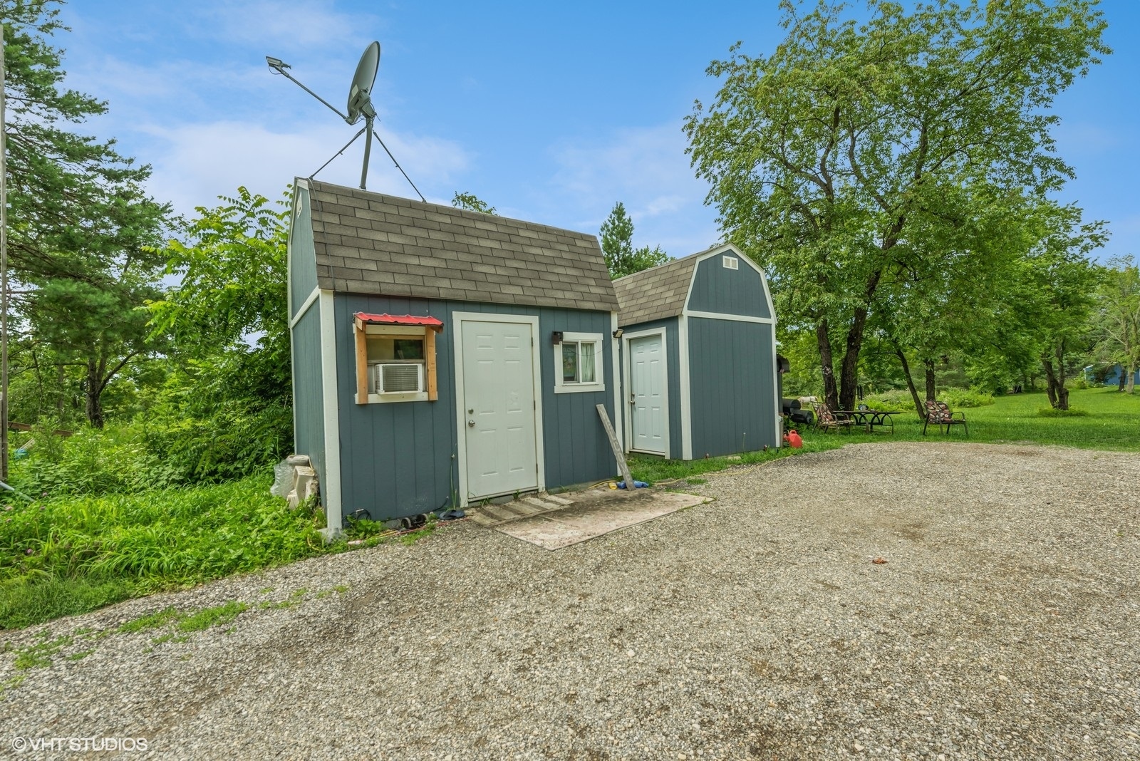 18809 Il Route 173 Harvard, IL 60033 - Photo 1 of 11 a front view of a house with a yard and garage