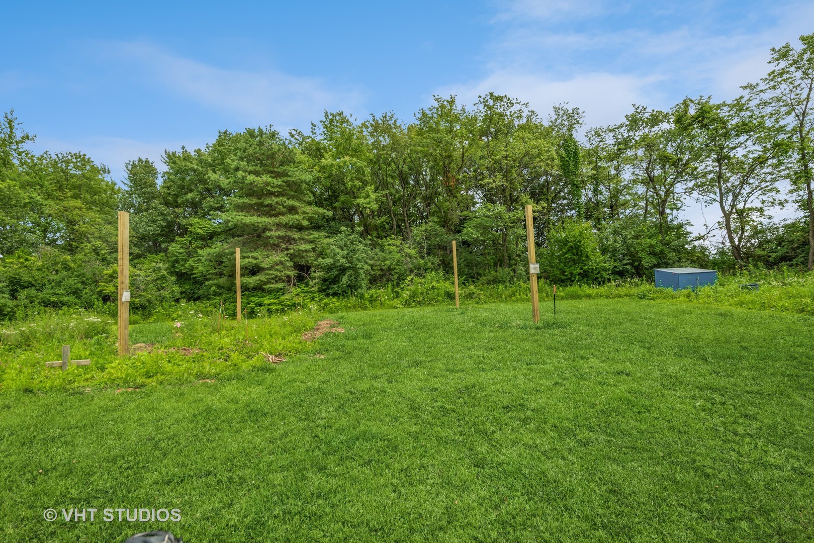 18809 Il Route 173 Harvard, IL 60033 - Photo 2 of 11 a view of a field with a tree in the background