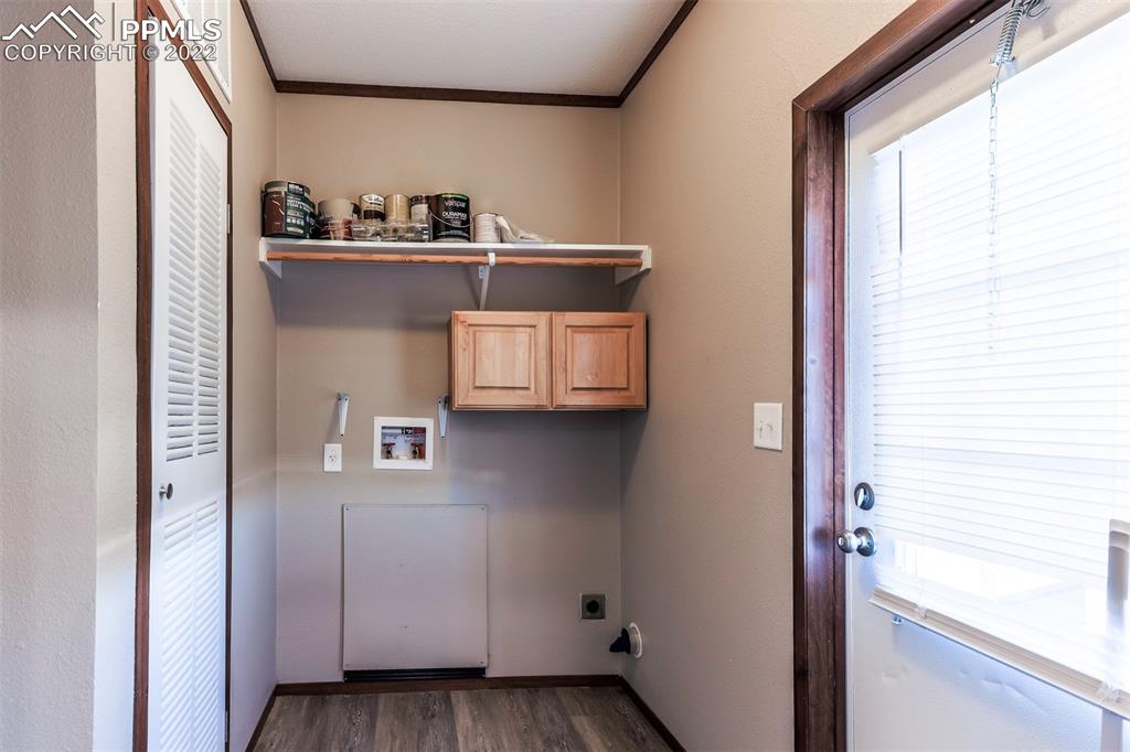703 Buffalo Run Road Calhan, CO 80808 - Photo 13 of 25 a view of walk in closet with clothes and shoes