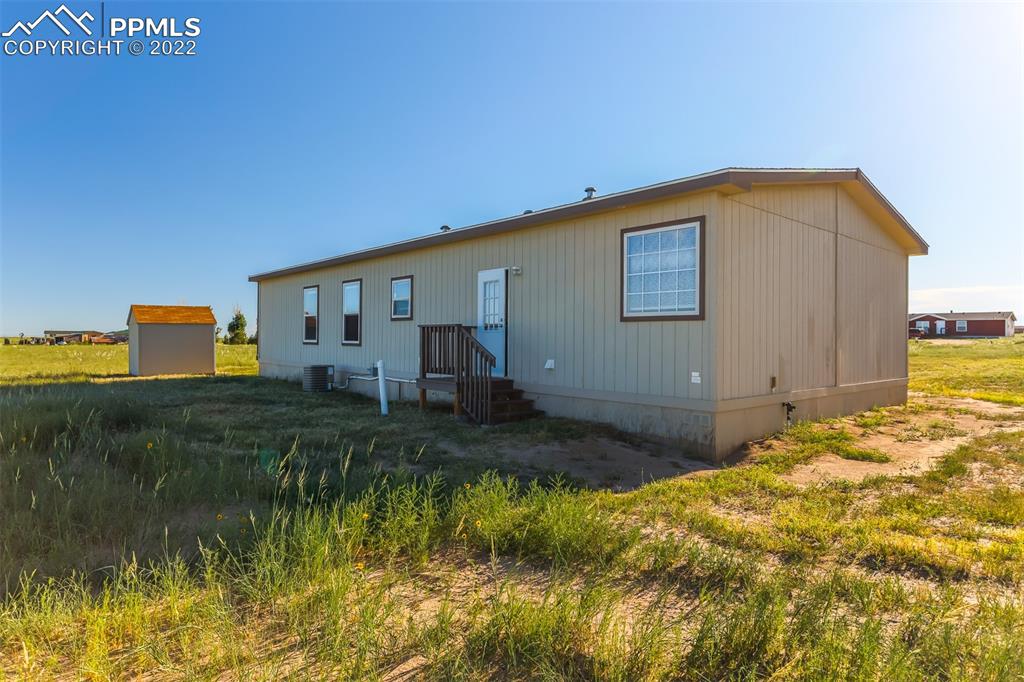 703 Buffalo Run Road Calhan, CO 80808 - Photo 3 of 25 a backyard of a house