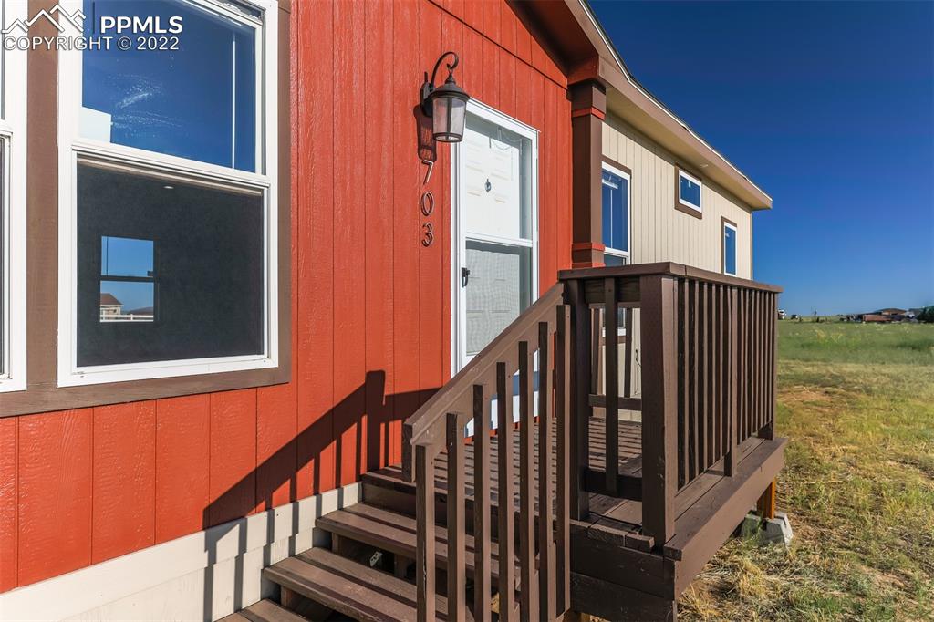703 Buffalo Run Road Calhan, CO 80808 - Photo 5 of 25 a view of balcony and wooden floor