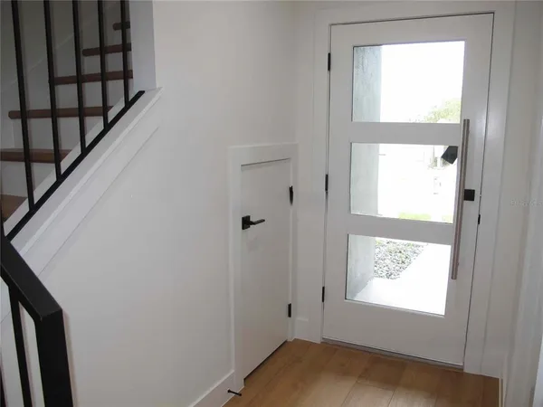 a view of an empty room and a window