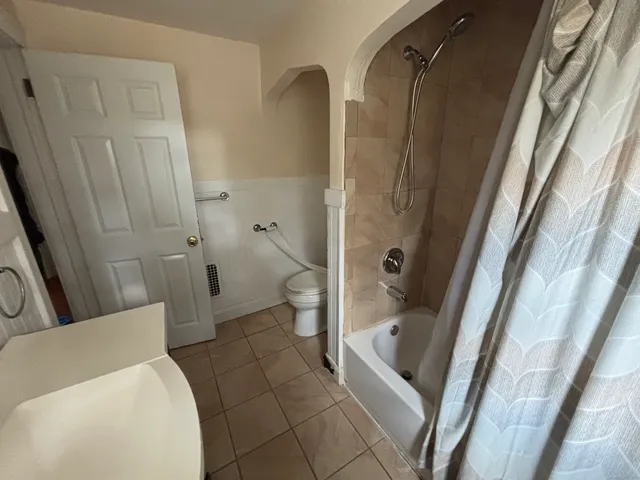 a bathroom with a tub and a shower