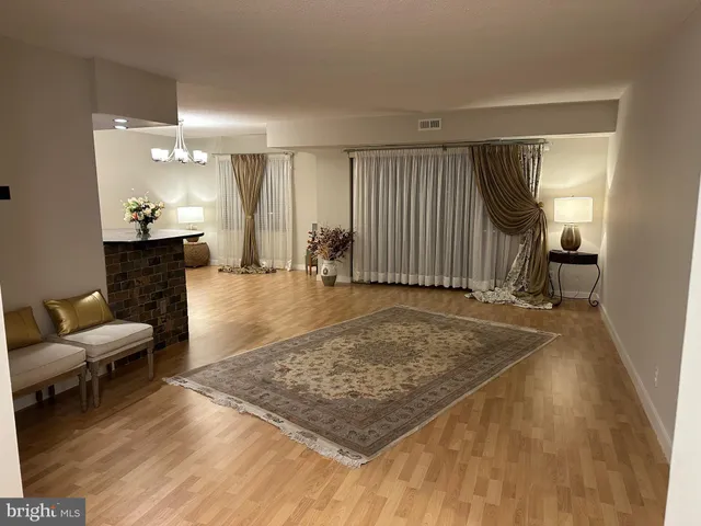 a view of a livingroom with furniture and a rug