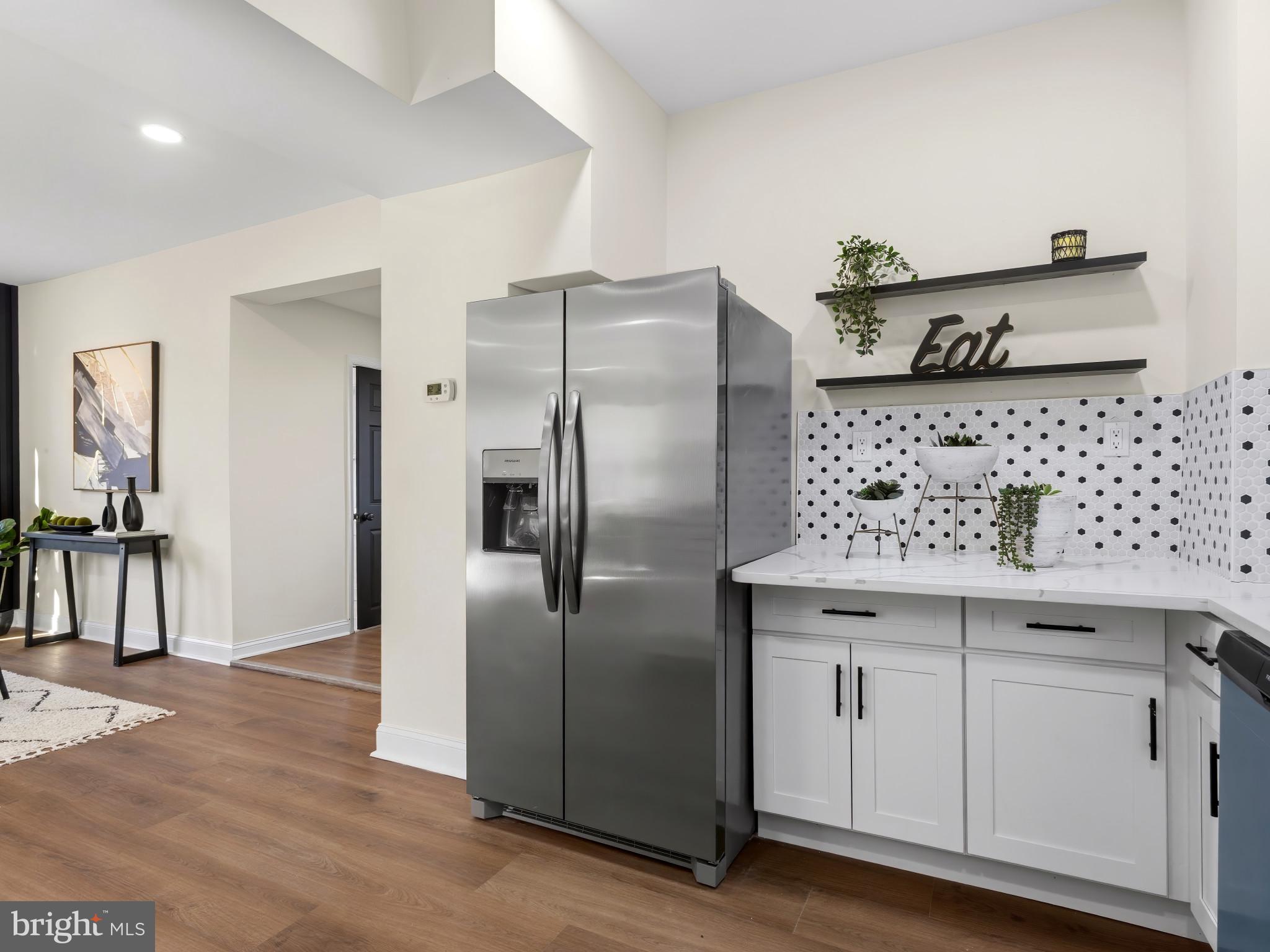 4600 White Avenue Baltimore, MD 21206 - Photo 13 of 40 a kitchen with stainless steel appliances granite countertop a refrigerator and a sink