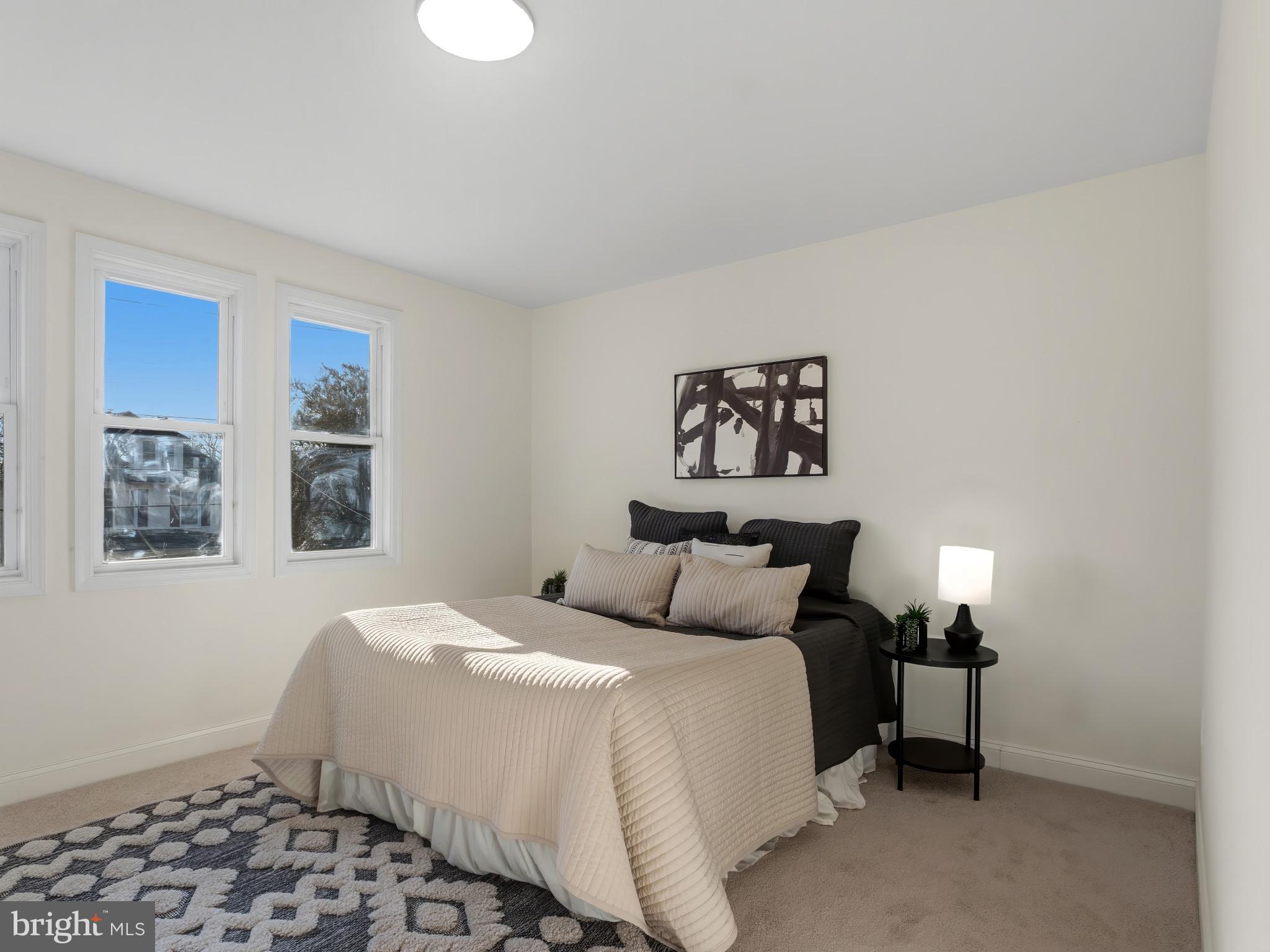 4600 White Avenue Baltimore, MD 21206 - Photo 16 of 40 a bedroom with a bed and a window