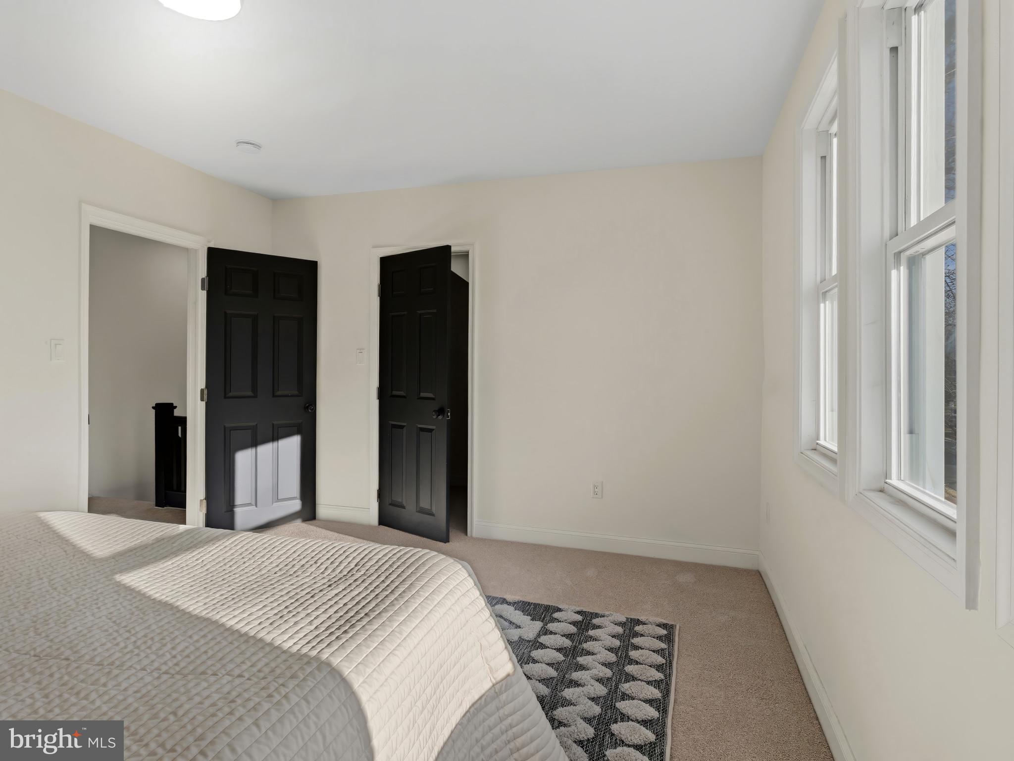 4600 White Avenue Baltimore, MD 21206 - Photo 17 of 40 a bedroom with a bed and a window