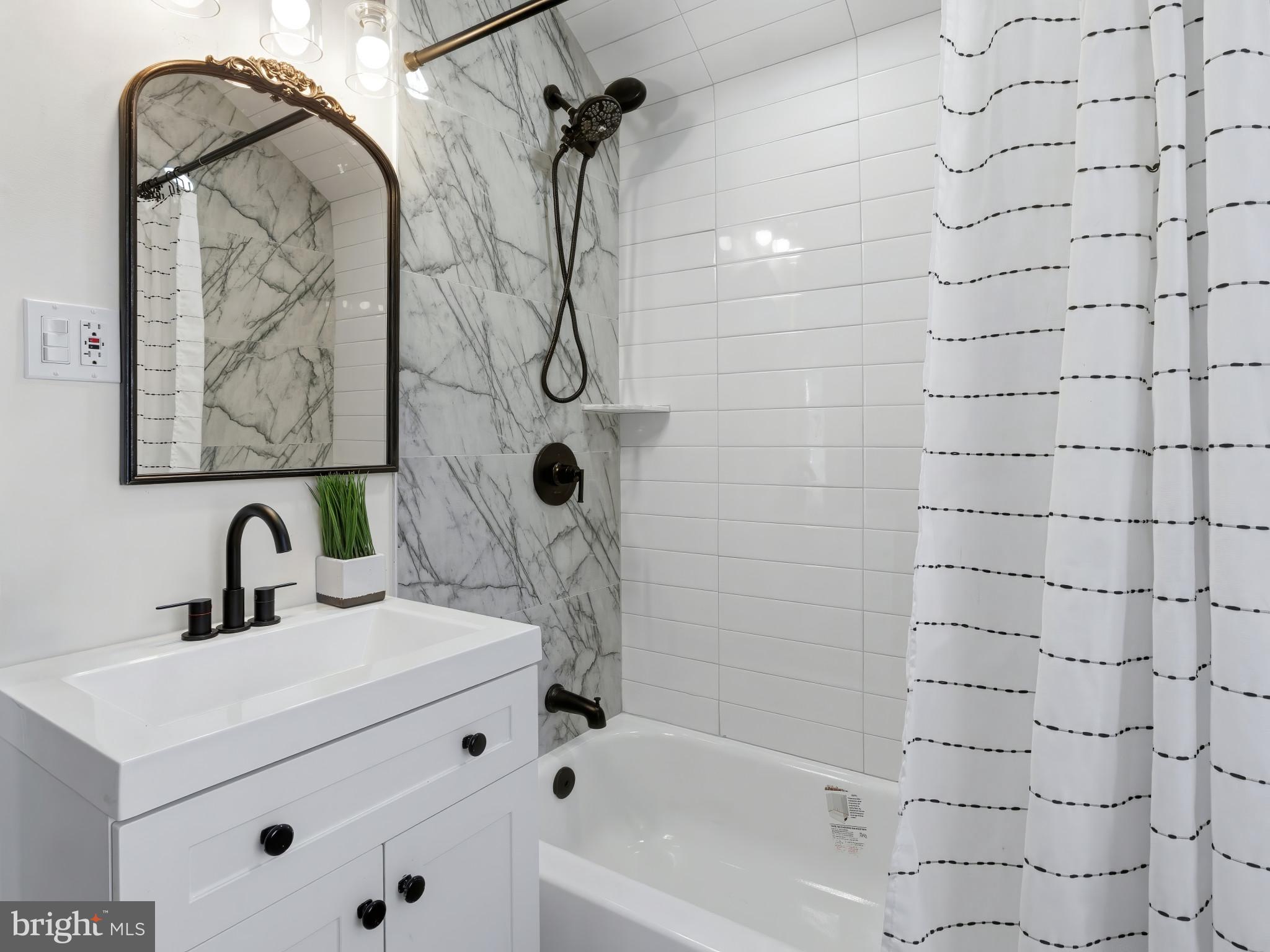 4600 White Avenue Baltimore, MD 21206 - Photo 18 of 40 a bathroom with a sink toilet and shower